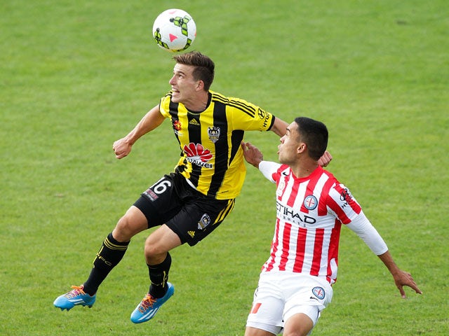 Louis Fenton of the Phoenix wins a header over Iain Ramsay of Melbourne City during the round 17 A-League match between Wellington Phoenix and Melbourne City FC at the Hutt Recreation Ground on February 14, 2015