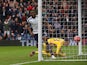 West Bromwich Albion's Nigerian striker Brown Ideye celebrates scoring the opening goal as West Ham United's Spanish goalkeeper Adrian reacts during the English FA Cup fifth round football match between West Bromwich Albion and West Ham United at The Hawt