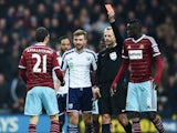 Morgan Amalfitano of West Ham United is shown a red card by referee Martin Atkinson and is sent off during the FA Cup Fifth Round match between West Bromwich Albion and West Ham United at The Hawthorns on February 14, 2015