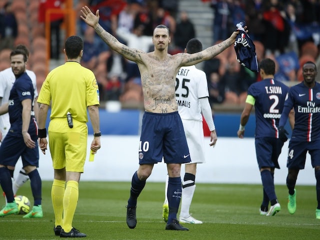 Paris Saint-Germain's Swedish forward Zlatan Ibrahimovic celebrates after scoring during the French L1 football match vs Caen on February 14, 2015