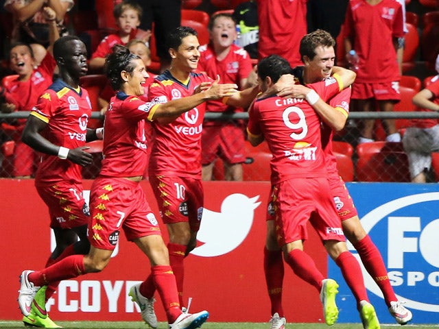 Sergio Cirio of United celebrates with his team mates after scoring during the round 18 A-League match between Adelaide United and Western Sydney Wanderers at Coopers Stadium on February 21, 2015
