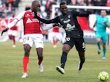 Reims' French defender Antoine Conte (L) vies with Metz' Malian forward Modibo Maiga (R) during the French Football match between Reims and Metz, on February 22, 2015