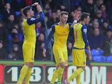 Olivier Giroud of Arsenal celebrates with Calum Chambers and Mesut Oezil as he scores their second goal during the Barclays Premier League match between Crystal Palace and Arsenal at Selhurst Park on February 21, 2015