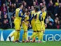 Santi Cazorla of Arsenal celebrates with team mates as he scores their first goal from a penalty during the Barclays Premier League match between Crystal Palace and Arsenal at Selhurst Park on February 21, 2015