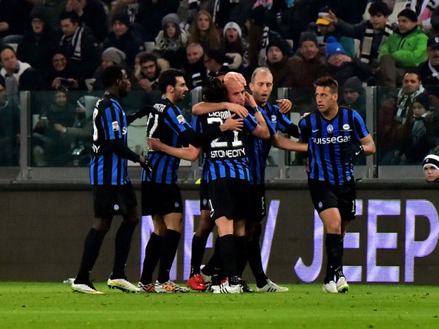 Atalanta's midfielder Giulio Migliaccio celebrates after scoring a goal on February 20, 2015