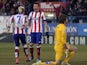 Atletico Madrid's French forward Antoine Griezmann celebrates after scoring with Atletico Madrid's Croatian forward Mario Mandzukic beside Almeria's goalkeeper Julian Cuesta during the Spanish league football match Atletico Madrid vs UD Almeria at the Vic