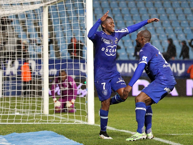 Bastia's French midfeilder Floyd Ayite is congratulated by teammates after scoring a goal during the French L1 football match Bastia (SCB) against Lille (LOSC) on February 21, 2015