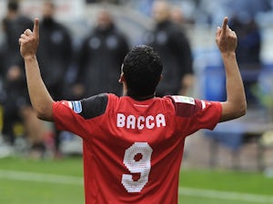 Carlos Bacca celebrates scoring for Sevilla on February 22, 2015