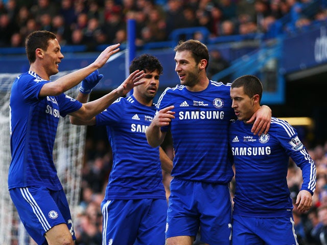 Branislav Ivanovic of Chelsea is congratulated by teammates after scoring the opening goal during the Barclays Premier League match between Chelsea and Burnley at Stamford Bridge on February 21, 2015