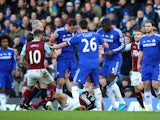 Referee Martin Atkinson shows the red card to Nemanja Matic of Chelsea for his reaction to the tackle by Ashley Barnes of Burnley during the Barclays Premier League match between Chelsea and Burnley at Stamford Bridge on February 21, 2015