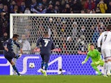 Porto's Brazilian defender Danilo (L) scores a penalty kick past Basel's Czech goalkeeper Tomas Vaclik (2nd R) to equalize during the UEFA Champions League round of 16 first leg football match on February 18, 2015