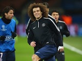 Paris Saint-Germain's David Luiz warms up ahead of the Champions League encounter with his former side Chelsea on February 17, 2015
