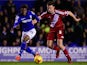 Birmingham forward Demarai Gray (l) is challenged by Middlesbrough defender Ben Gibson during the Sky Bet Championship match on February 18, 2015