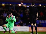 Middlesbrough goalkeeper Dimitrios Konstantopoulos reacts as referee David Coote brandishes the red card for a foul on Clayton Donaldson in a game against Birmingham on February 18, 2015