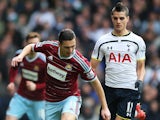 Erik Lamela of Spurs chases down West Ham's Stewart Downing on February 22, 2015