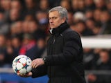 Chelsea manager Jose Mourinho handles the matchball suspiciously on February 17, 2015