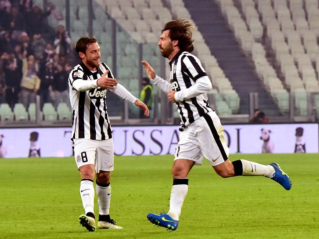 Juventus' midfielder Andrea Pirlo celebrates after scoring a goal with Juventus' midfielder Claudio Marchisio during their Serie A match Juventus vs Atalanta at Juventus Stadium in Turin on February 20, 2015