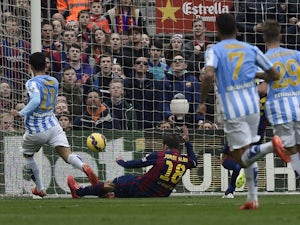 Malaga's Argentinian midfielder Pablo Javier Perez scores a goal during the Spanish league football match FC Barcelona vs Malaga CF at the Camp Nou stadium in Barcelona on February 21, 2015