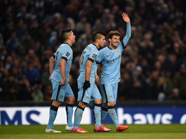 David Silva of Manchester City celebrates scoring their fourth goal during the Barclays Premier League match between Manchester City and Newcastle United at Etihad Stadium on February 21, 2015