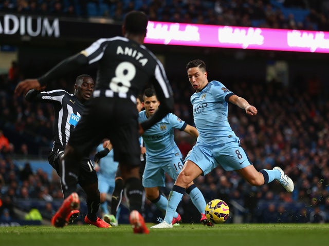 Samir Nasri of Manchester City runs on goal to score their second during the Barclays Premier League match between Manchester City and Newcastle United at Etihad Stadium on February 21, 2015
