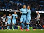 Sergio Aguero of Manchester City celebrates scoring the opening goal from the penalty spot with David Silva of Manchester City during the Barclays Premier League match between Manchester City and Newcastle United at Etihad Stadium on February 21, 2015