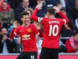 Ander Herrera of Manchester United celebrates scoring the opening goal with Wayne Rooney of Manchester United during the Barclays Premier League match between Swansea City and Manchester United at Liberty Stadium on February 21, 2015