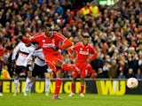 Mario Balotelli of Liverpool scores the opening goal from the penalty spot during the UEFA Europa League Round of 32 match against Besiktas on February 19, 2015