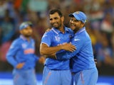 Mohammed Shami of India celebrates with Suresh Raina after dismissing Dale Steyn of South Africa during the 2015 ICC Cricket World Cup match between South Africa and India at Melbourne Cricket Ground on February 22, 2015