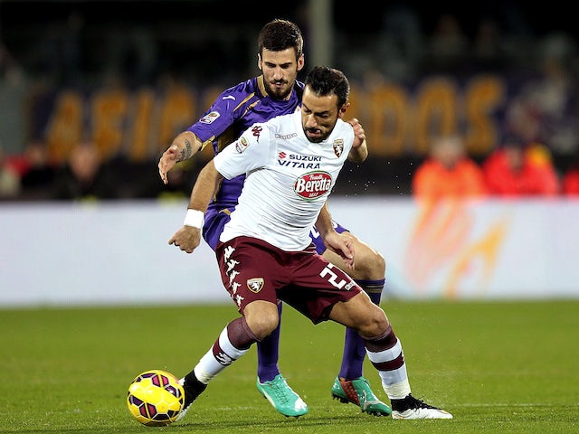 Nenad Tomovic of ACF Fiorentina battles for the ball with Fabio Quagliarella of Torino FC during the Serie A match on February 22, 2015