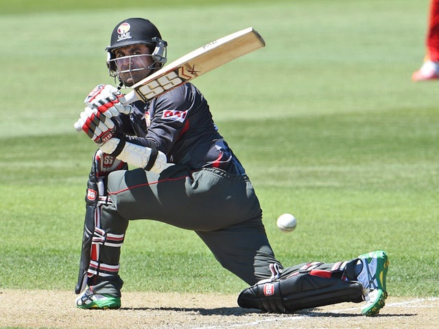 United Arab Emirates batsman Shaiman Anwar sweeps a ball from the Zimbabwe bowling during their 2015 Cricket World Cup match in Nelson on February 19, 2015