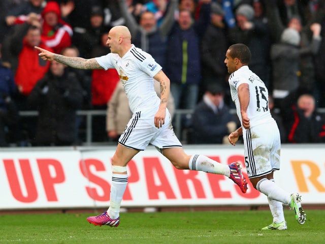 Jonjo Shelvey of Swansea City celebrates scoring their second goal with Wayne Routledge of Swansea City during the Barclays Premier League match between Swansea City and Manchester United at Liberty Stadium on February 21, 2015