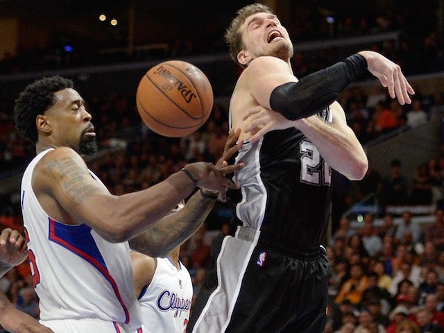 Tiago Splitter of the San Antonio Spurs battles with DeAndre Jordan of the Los Angeles Clippers on February 19, 2015