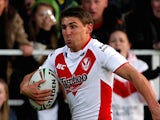 Tommy Makinson (L) of St Helens in action during the Stobart Super League play off match between St Helens and Warrington Wolves on September 29, 2012