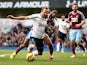 Harry Kane of Spurs goes down under the challenge from Alexandre Song of West Ham to win an injury time penalty during the Barclays Premier League match between Tottenham Hotspur and West Ham United at White Hart Lane on February 22, 2015