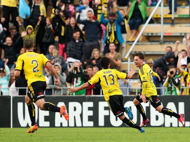 Jason Hicks of the Phoenix celebrates with teammate Albert Riera after scoring a goal during the round 18 A-League match between Wellington Phoenix and Newcastle Jets at Hutt Recreation Ground on February 22, 2015