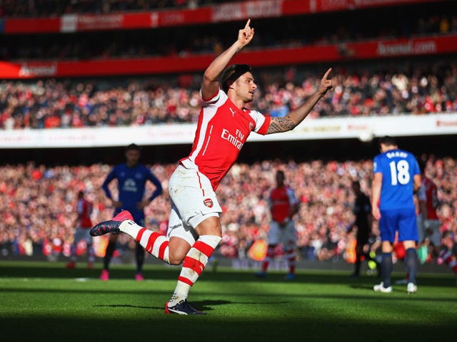 Olivier Giroud of Arsenal celebrates as he scores their first goal during the Barclays Premier League match between Arsenal and Everton at Emirates Stadium on March 1, 2015