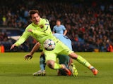 Lionel Messi of Barcelona draws a foul from Pablo Zabaleta of Manchester City in the area to win a penalty during the UEFA Champions League Round of 16 match between Manchester City and Barcelona at Etihad Stadium on February 24, 2015