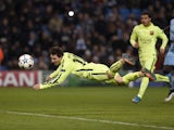 Barcelona's Argentinian forward Lionel Messi heads the ball wide off the rebound from his penalty that was saved by Manchester City's English goalkeeper Joe Hart during the UEFA Champions League round of 16 first leg football match between Manchester City