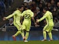 Barcelona's Uruguayan forward Luis Suarez celebrates scoring the opening goal with Barcelona's Brazilian defender Dani Alves and Barcelona's Argentinian forward Lionel Messi during the UEFA Champions League round of 16 first leg football match between Man