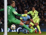 Barcelona's Uruguayan forward Luis Suarez watches his shot go past Manchester City's English goalkeeper Joe Hart during the UEFA Champions League round of 16 first leg football match between Manchester City and Barcelona at the Etihad Stadium in Mancheste