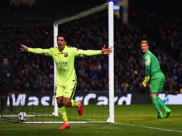Luis Suarez of Barcelona celebrates scoring their second goal during the UEFA Champions League Round of 16 match between Manchester City and Barcelona at Etihad Stadium on February 24, 2015