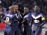 Bordeaux' Isaac Thelin celebrates with teammates after scoring goal during the French L1 football match between Reims and Bordeaux on February 28, 2014
