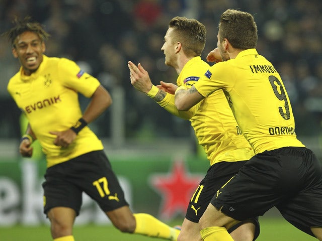 Marco Reus of Borussia Dortmund celebrates his goal with his team-mate Ciro Immobile (R) during the UEFA Champions League Round of 16 match between Juventus and Borussia Dortmund at Juventus Arena on February 24, 2015