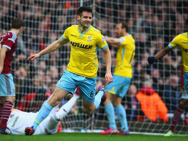 Scott Dann of Crystal Palace celebrates as he scores their second goal during the Barclays Premier League match between West Ham United and Crystal Palace at Boleyn Ground on February 28, 2015