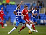 Daniel Williams of Reading battles for the ball with Ben Osborn of Nottingham Forest during the Sky Bet Championship match on February 28, 2015