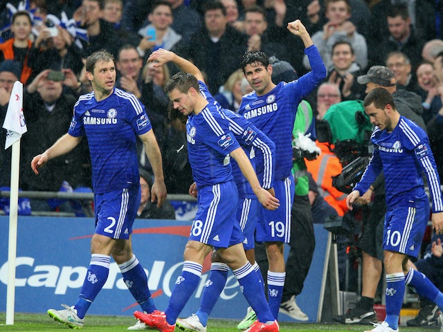 Diego Costa of Chelsea celebrates with team mates after his shot on goal is deflected in for a second by Kyle Walker of Spurs during the Capital One Cup Final match on March 1, 2015