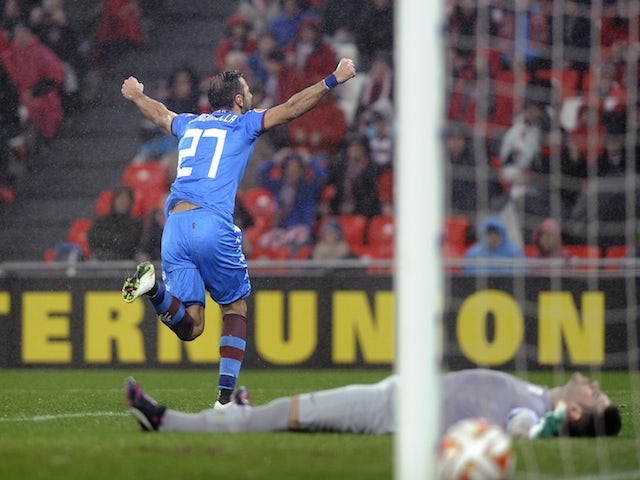 Torino's forward Fabio Quagliarella (L) celebrates after scoring during the UEFA Europa League Round of 32 second leg football match against Athletic Club Bilbao on February 26, 2015