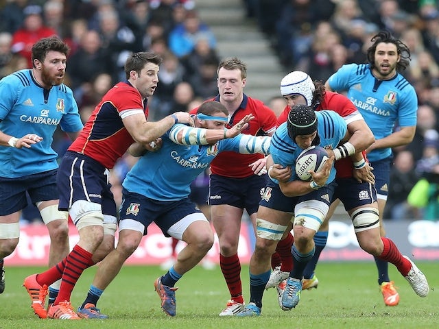 Italy's flanker Francesco Minto (3rd R) makes a break during the Six Nations international rugby union match between Scotland and Italy at Murrayfield in Edinburgh, Scotland on February 28, 2015