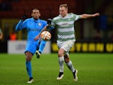 Juan of Inter Milan challenges John Guidetti of Celtic during the UEFA Europa League Round of 32 match on February 26, 2015