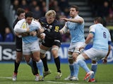 Juan Pablo Socino of Newcastle Falcons is tackled by Jackson Wray and Brad Barritt of Saracens during the Aviva Premiership match on February 28, 2015